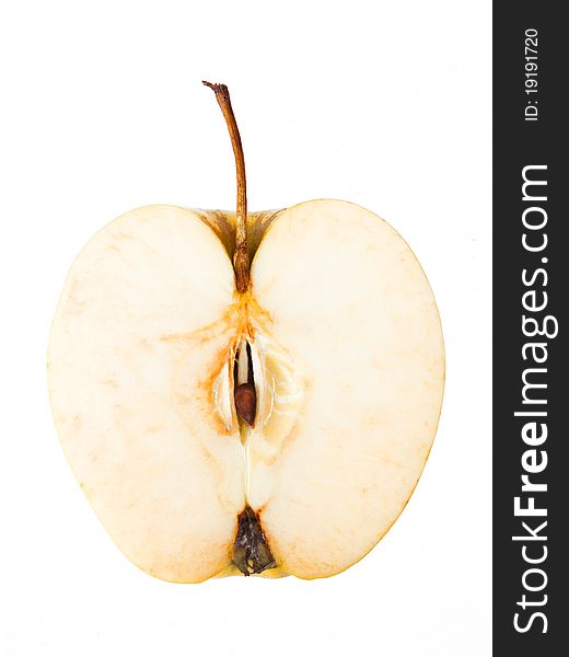 Half of a yellow apple on a white background