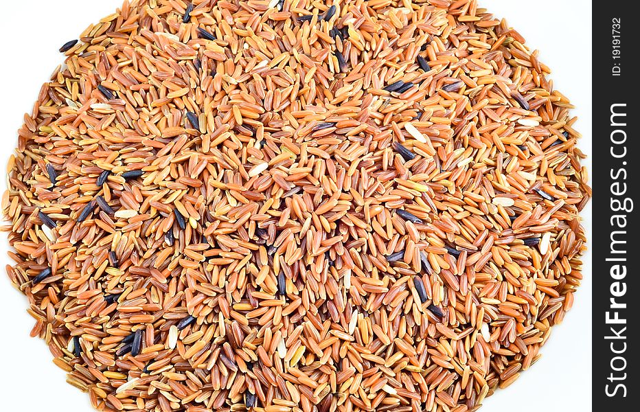 A Pile Of Brown Rice Isolate On White Background