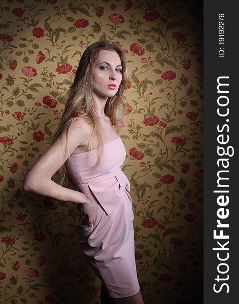 Portrait of the beauty girl in pink dress