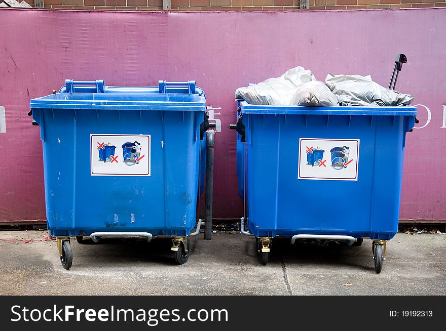 Two garbage trash on public street. Two garbage trash on public street