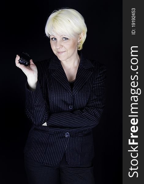 Attractive business woman showing mobile phone