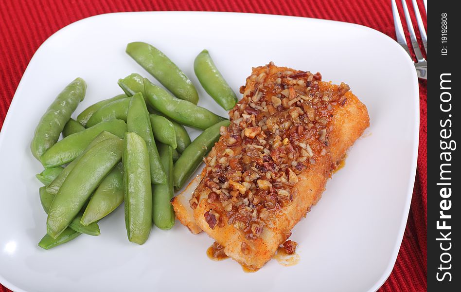 Fried cod fish fillet with snap peas. Fried cod fish fillet with snap peas