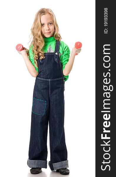 Young girl exercising with two pink dumbells. Young girl exercising with two pink dumbells.