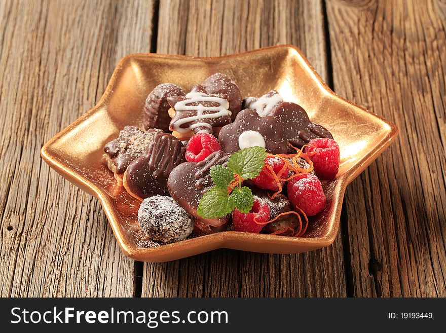 Delicious chocolate cookies and fresh raspberries. Delicious chocolate cookies and fresh raspberries