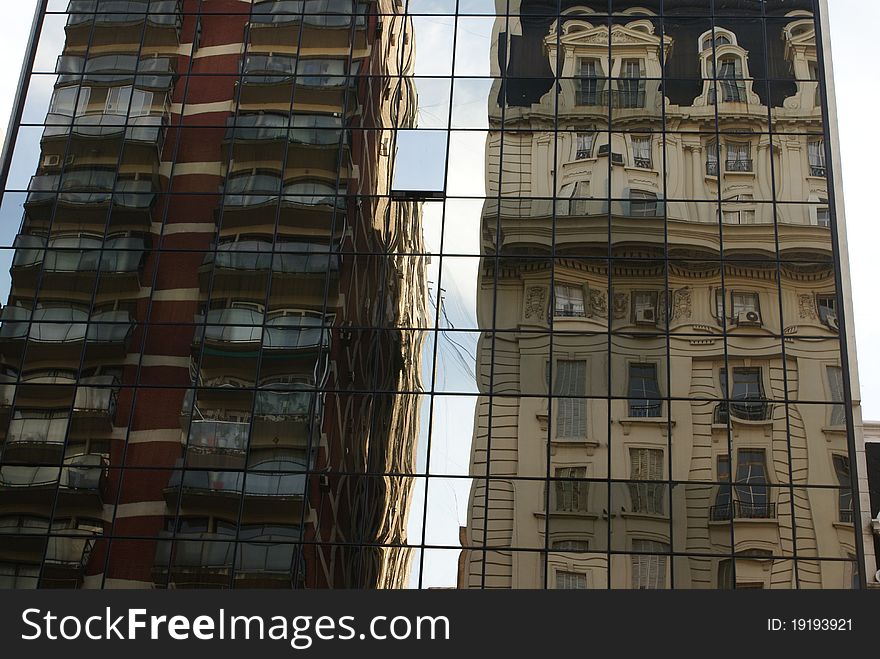 A street in Buenos Aires. Reflection of two tall buildings. A street in Buenos Aires. Reflection of two tall buildings.