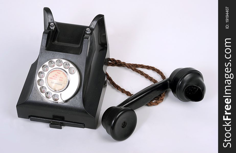 An old dial type 1940-50s bakelite telephone. An old dial type 1940-50s bakelite telephone.
