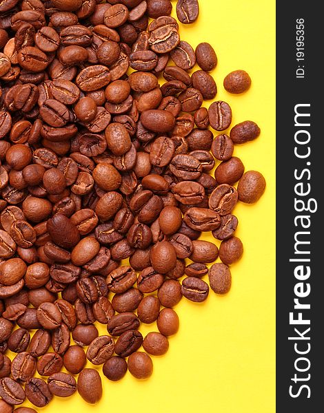 Coffee beans on a yellow background Ð¡olor image