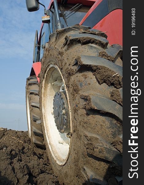 Tractor plowing a field after the autumn harvest. Tractor plowing a field after the autumn harvest