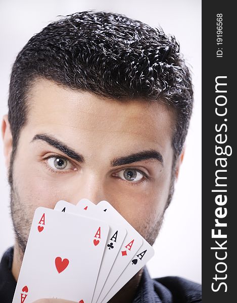 Man with ace poker; four aces in hands; smiling and looking in camera. Man with ace poker; four aces in hands; smiling and looking in camera.