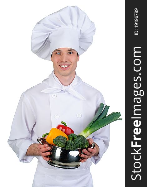 Young cook with vegetables in pan. Young cook with vegetables in pan