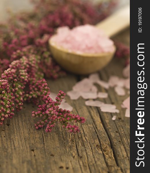 With pink herbs on the wooden background. With pink herbs on the wooden background