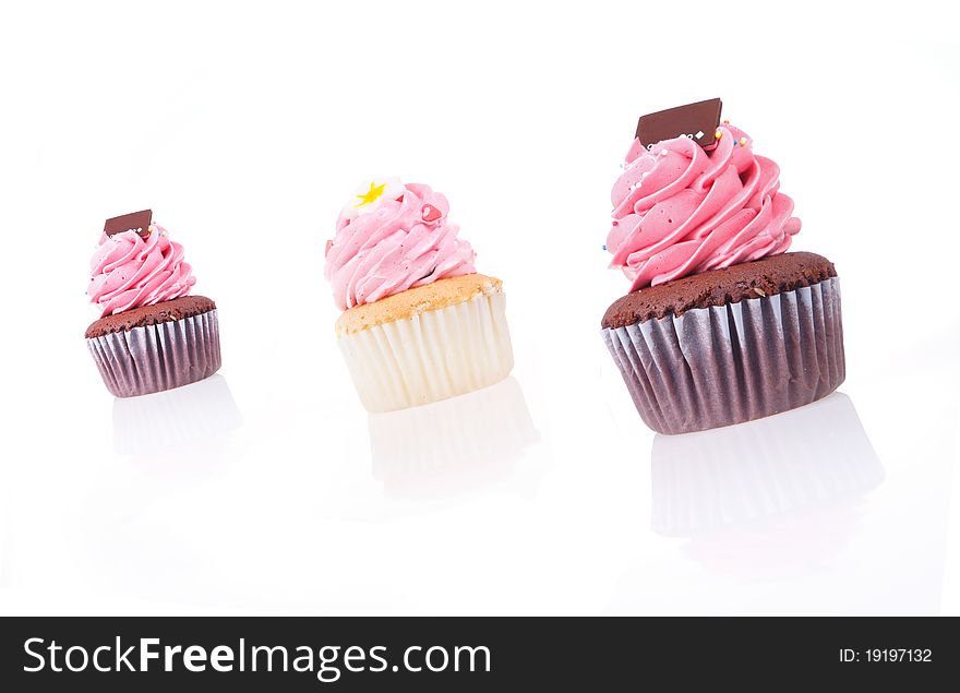 Strawberry cream chocolate cupcake isolated on white background