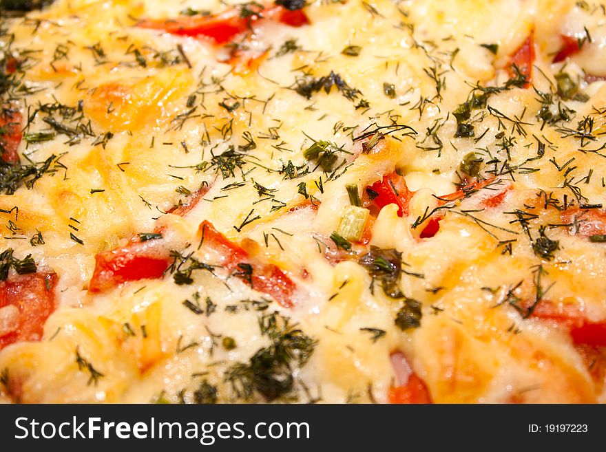 Juicy appetizing pizza with tomato and cheese