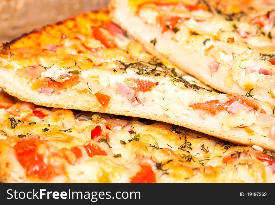 Juicy appetizing pizza with tomato and cheese