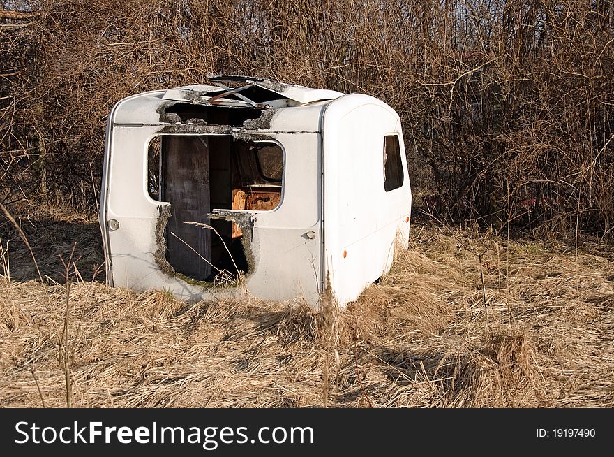 Photo of burned caravan on field