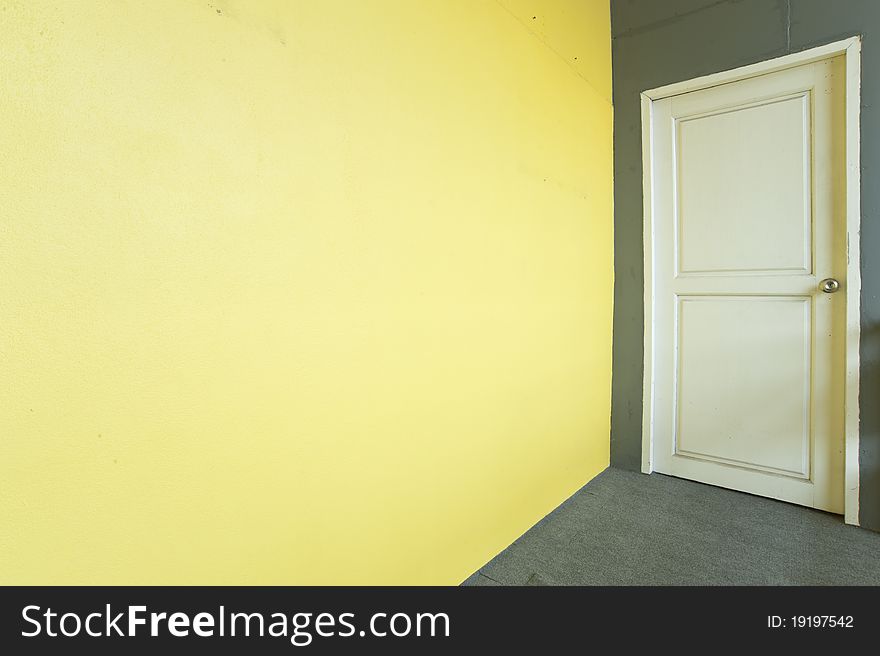 White door and yellow wall