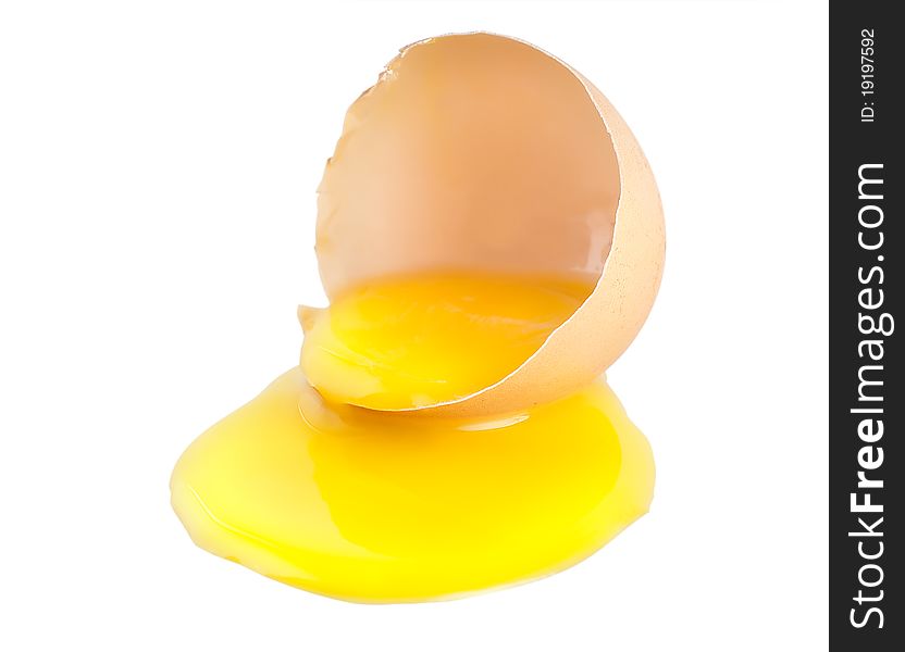 Broken egg with a yellow yolk isolated on white background. Broken egg with a yellow yolk isolated on white background