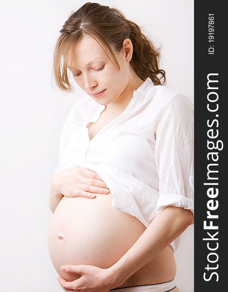 Pregnant woman caress her belly. Pregnant woman caress her belly
