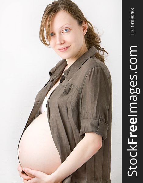 Pregnant woman holding her belly. Pregnant woman holding her belly