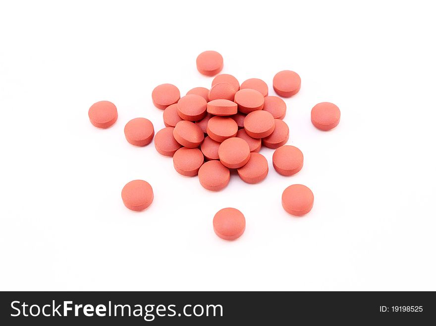 Small pile of pills isolated over white background