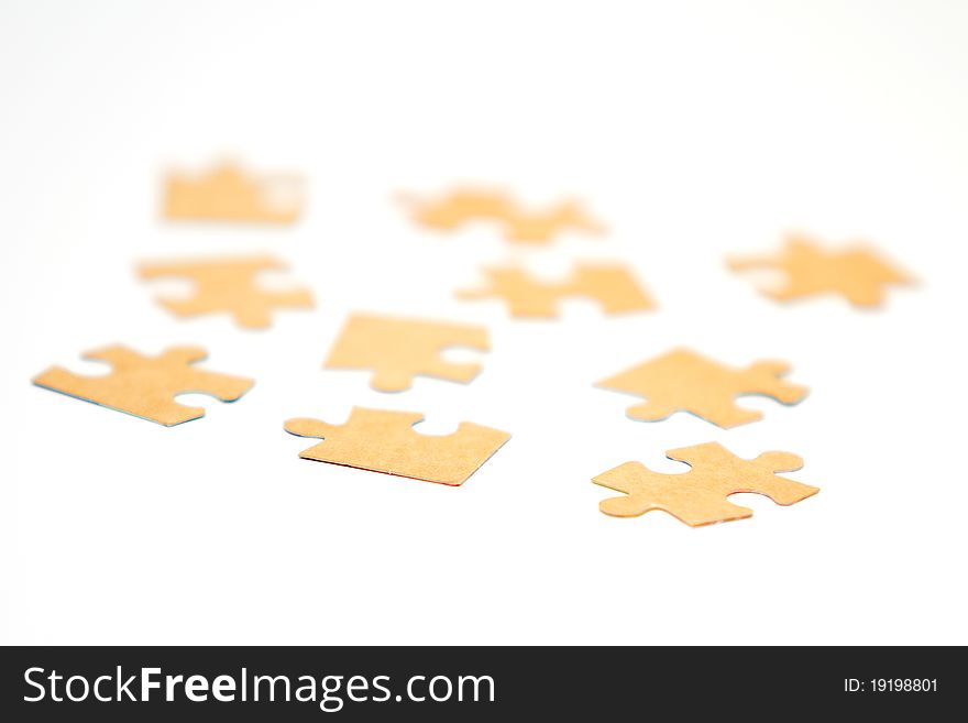 Cardboard jigsaw puzzle isolated on white background