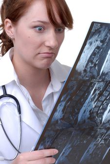 Female Doctor Reading An X-Ray Royalty Free Stock Photos Female Doctor Reading An X-Ray Royalty Free Stock Photos