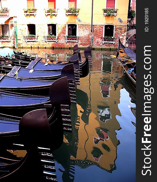 Gondolas in Venice and reflection in canal