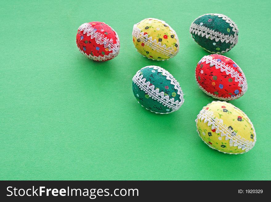 Six easter eggs on the green background - the symbol of spring. Six easter eggs on the green background - the symbol of spring