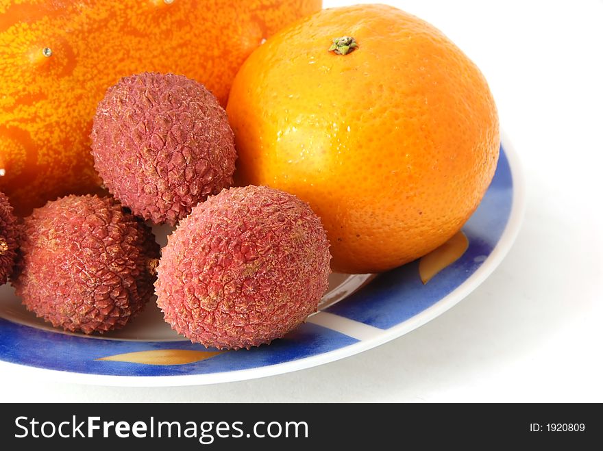 Fresh tropical fruit on a plate. Fresh tropical fruit on a plate