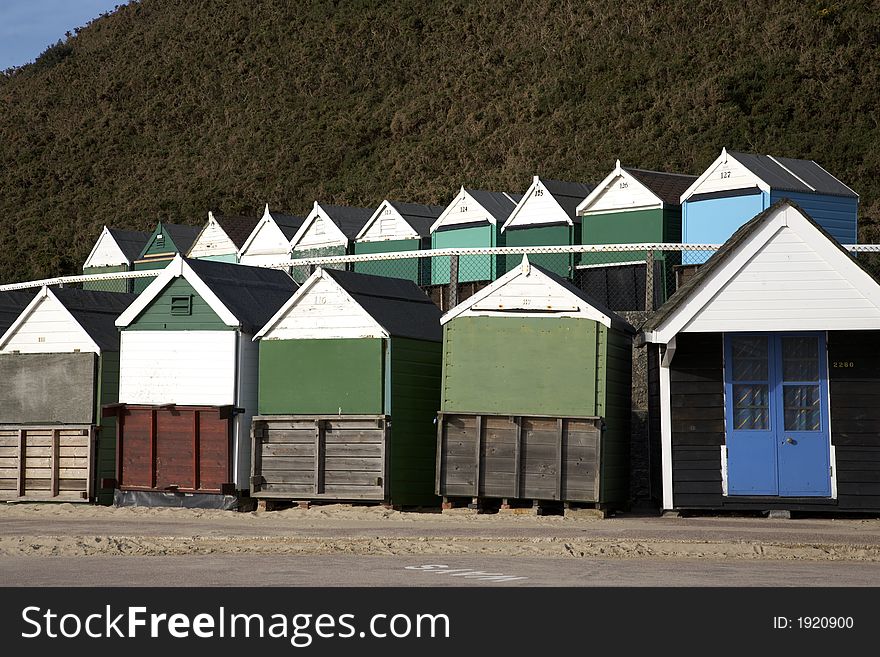 Wooden beach huts in the spring along west cliff bournemouth dorset england uk