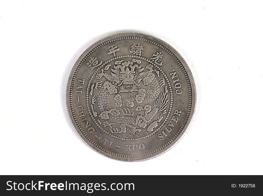 Old Chinese coin isolated over white