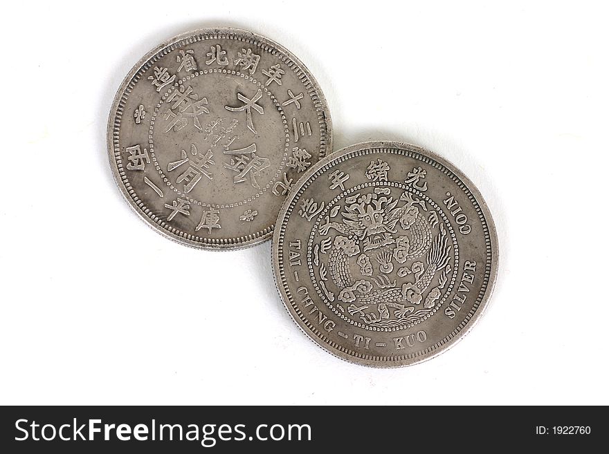 Old Chinese coins isolated over white