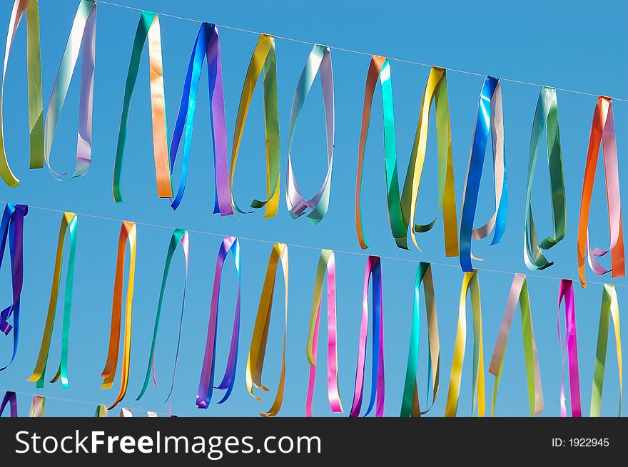 Carnival street decoration ribbons hanging on wire