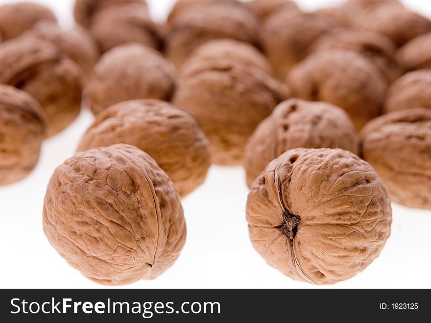 Walnuts background texture. Macro photo.