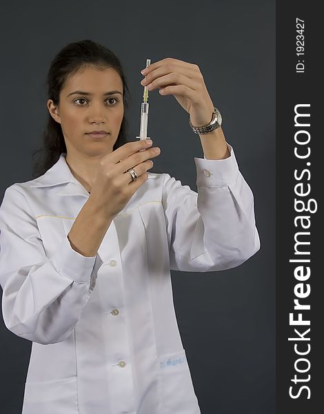 Young female doctor with injection