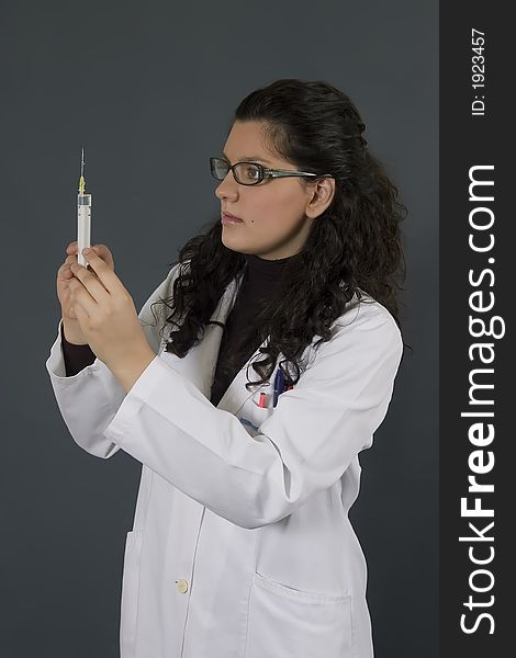 Young female doctor with injection