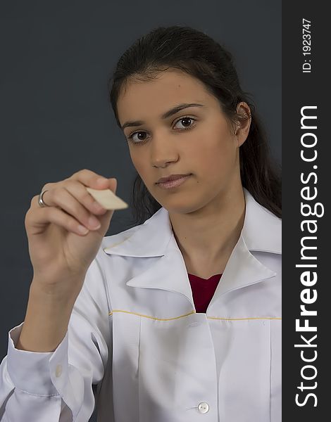 Young female doctor in white lab coat. Young female doctor in white lab coat