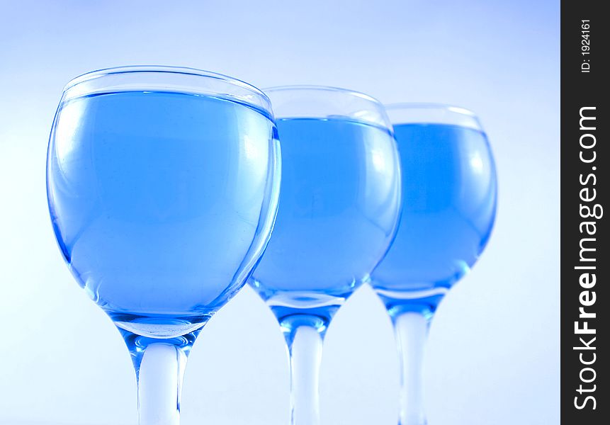Glasses with a blue liquid