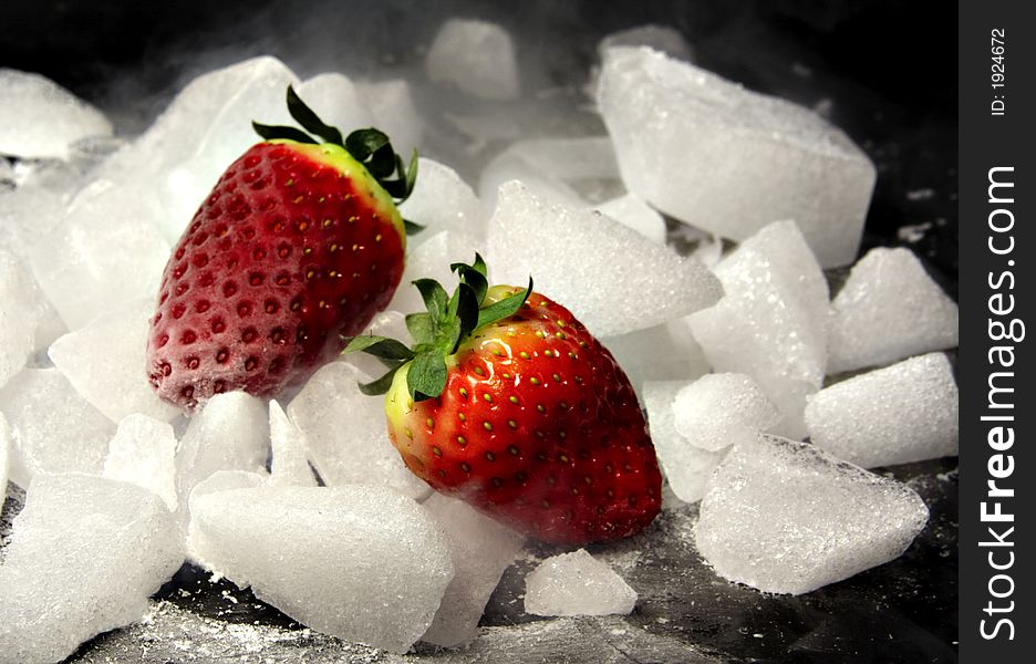 Two strawberries on rocks of ice. Two strawberries on rocks of ice