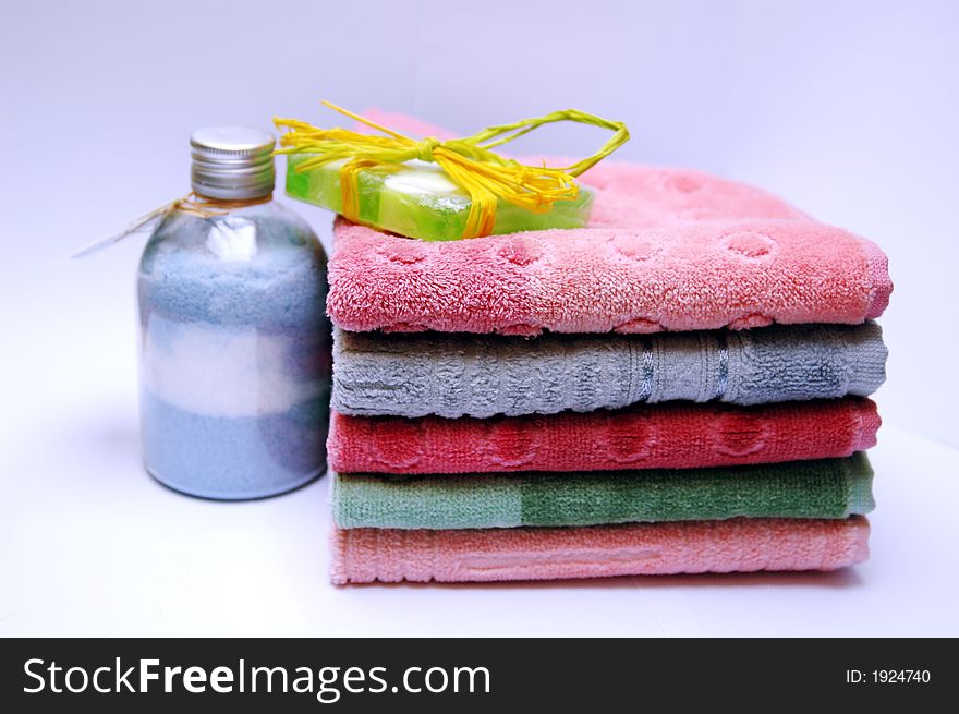 Bath towels of different colours piled on top of one another. Bath towels of different colours piled on top of one another