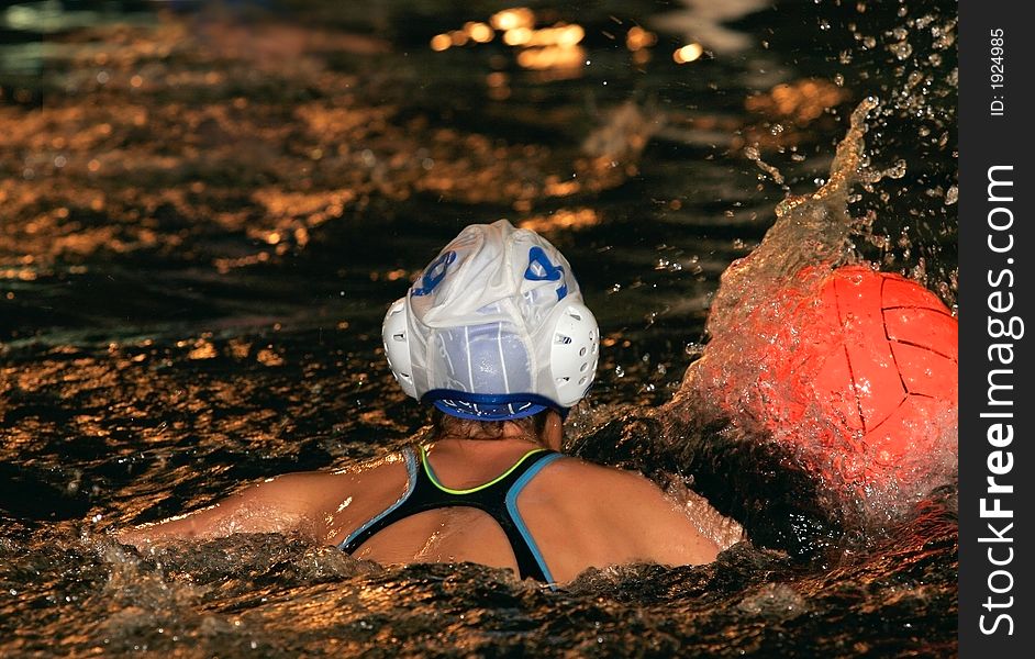 The floating child in water with sparks and red ball. The floating child in water with sparks and red ball