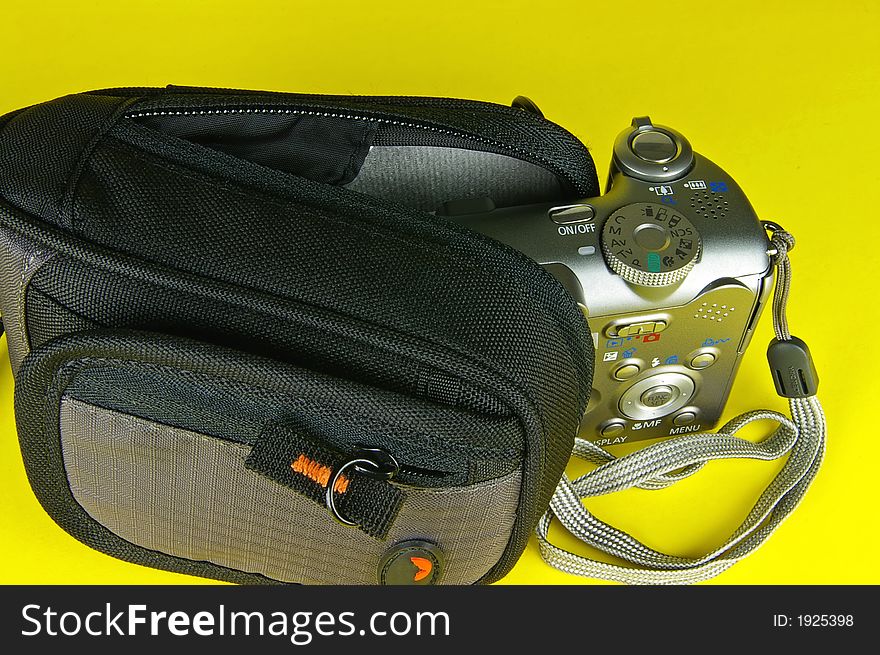 Compact digital camera and camera bag - isolated