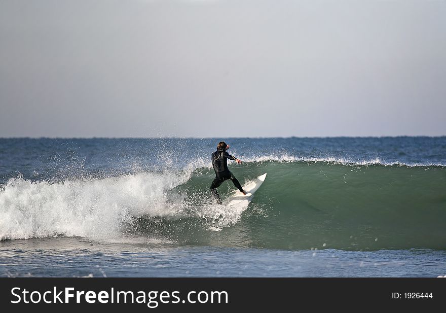 Surfer preparing a floater in the wave