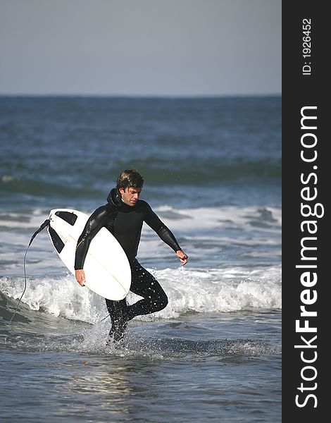 Surfer portrait holding a board