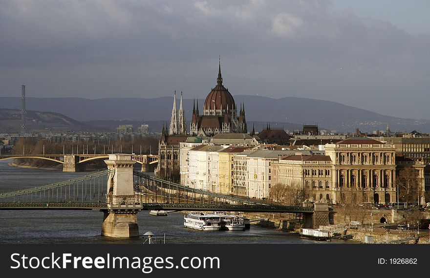 View of Hungarian Parliament and Szechenyi chain bridge on the river Danube in Budapest. View of Hungarian Parliament and Szechenyi chain bridge on the river Danube in Budapest