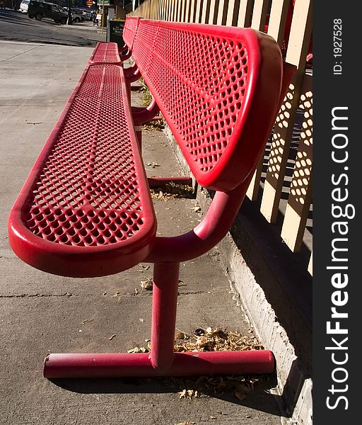 Red metal bench located at resturant. Red metal bench located at resturant.