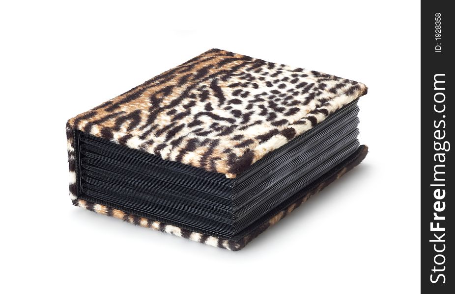Photoalbum in leopard cover isolated on white