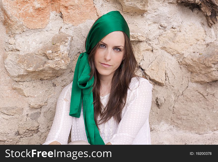 Young attractive woman portraited infront of the wall. Young attractive woman portraited infront of the wall