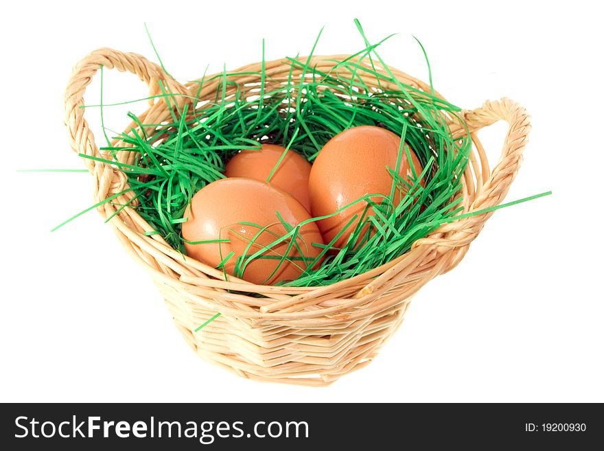 Decorative basket with eggs and grass