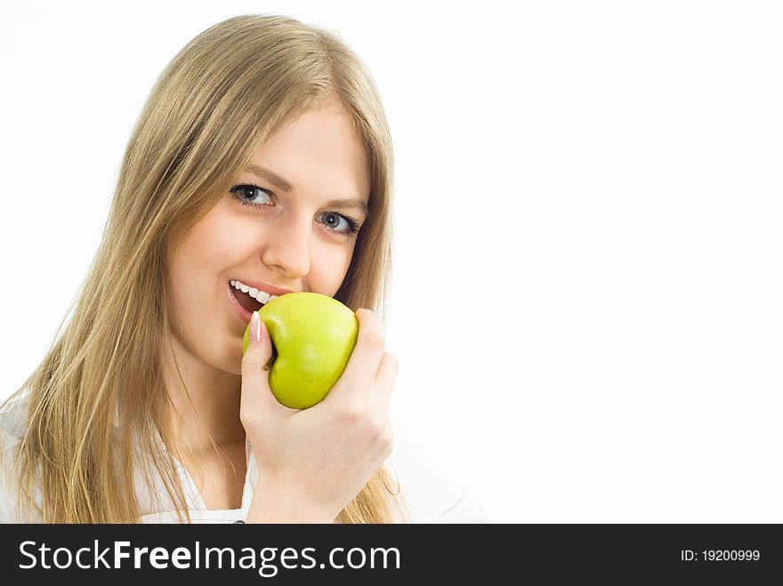 Young girl holding an apple on a white background. Young girl holding an apple on a white background